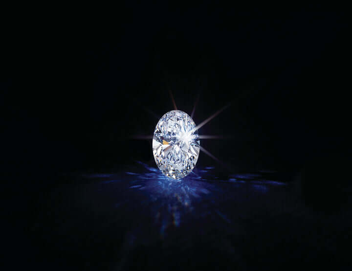 Single diamond on a black background