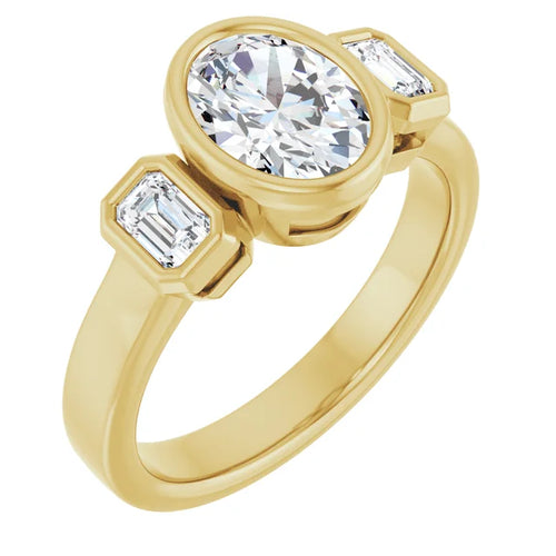 Load image 1 in gallery view. Three-quarter angled view of the 14K yellow gold three-stone ring, an oval lab-grown diamond in a full bezel between two emerald-cut lab-grown diamonds, on a wide flat band