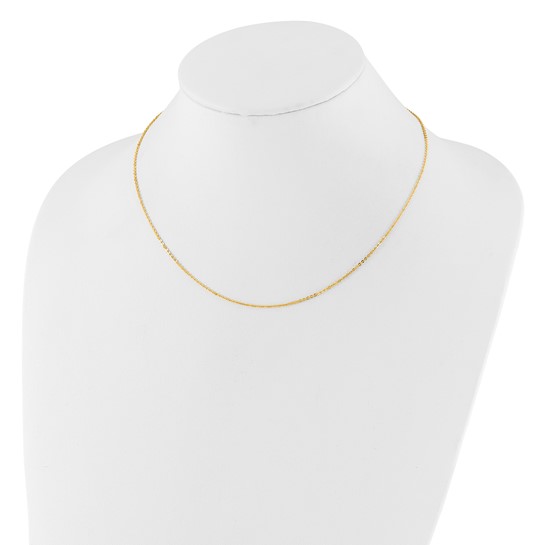 The thin 14K yellow gold cable chain displayed on a white necklace bust to show how it sits at the base of the neck
