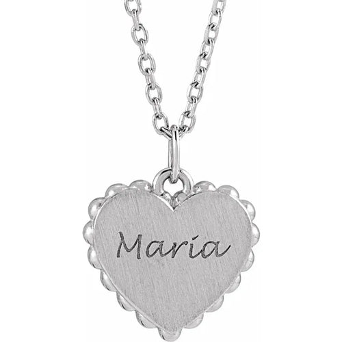 Load image 1 in gallery view. Example of engraving: the sterling silver heart pendant shown with a name engraved across the face