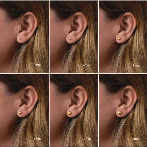 Load image 1 in gallery view. Size comparison of 14K yellow gold ball stud earrings on a model's ear, shown in 3mm, 4mm, 5mm, 6mm, 7mm and 8mm.