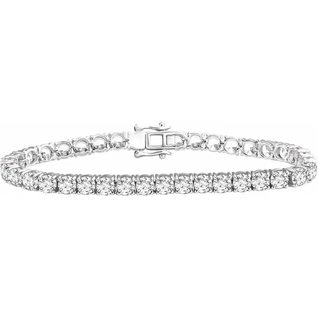 14K white gold tennis bracelet with a continuous line of round lab-grown diamonds in four-prong settings, box clasp at centre