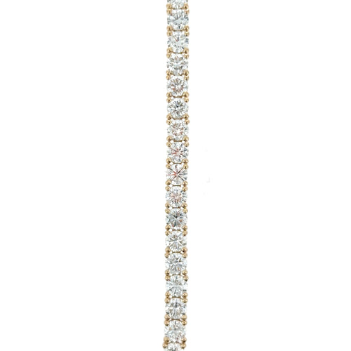 Load image 1 in gallery view. Close-up of the straight line of round lab-grown diamonds in yellow gold four-prong settings