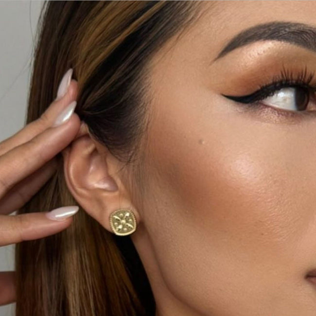 Close-up of a woman wearing 14K Yellow Derafsh Kaviani Earring