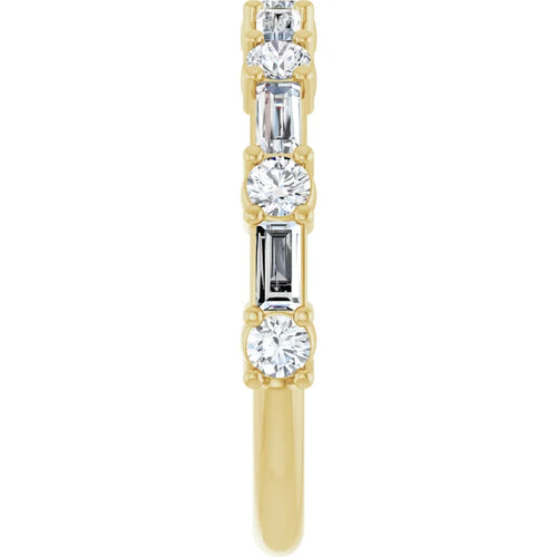 Load image 1 in gallery view. Side profile of the yellow gold band showing prong-set round and baguette lab-grown diamonds on a slim shank