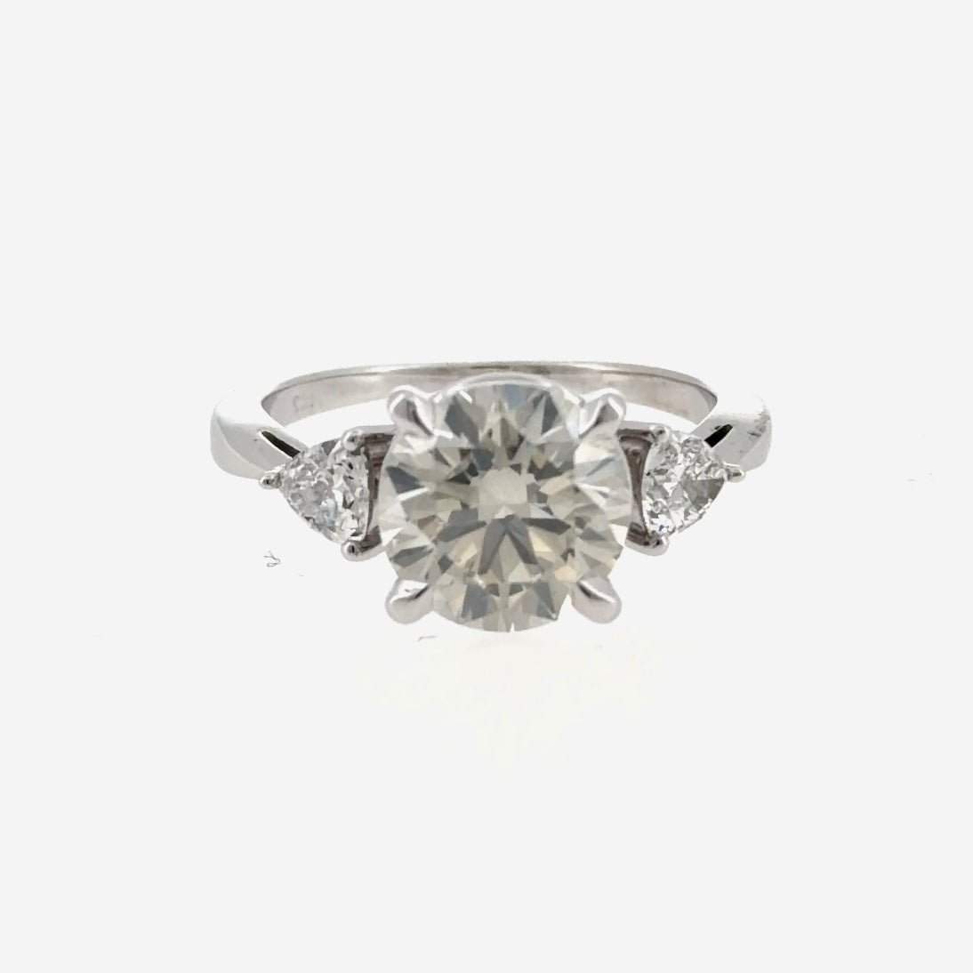 14K white gold three-stone engagement ring with two trillion lab-grown diamonds, front view, shown with a round center stone that is not included