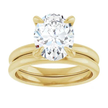2 carat oval lab-grown diamond solitaire engagement ring in 14K yellow gold, shown stacked with a matching wedding band that is not included