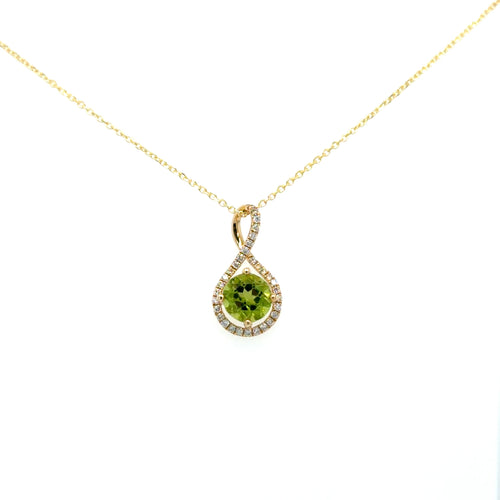 Load image 1 in gallery view. 14K yellow gold peridot pendant on a gold chain — round green peridot held inside a diamond-lined teardrop frame that twists over itself into the bail, by Farsi Jewelers Sandy Springs