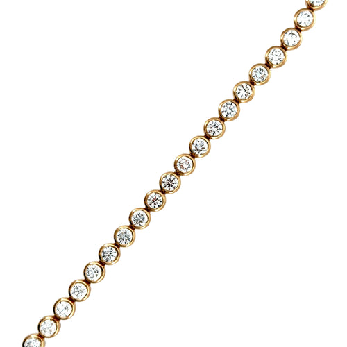 Load image 1 in gallery view. Close-up of the bezel-set lab-grown diamonds in 14K yellow gold, showing the smooth rim of gold around each stone