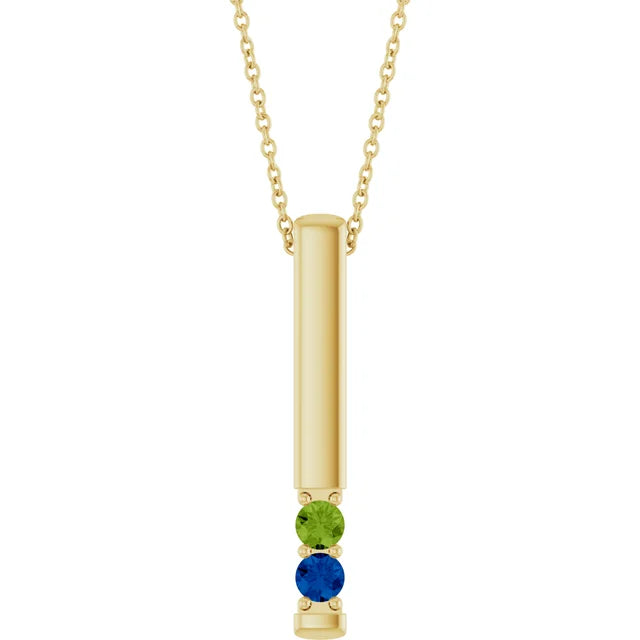 14K yellow gold vertical bar birthstone necklace with a peridot and a lab-grown blue sapphire, front view