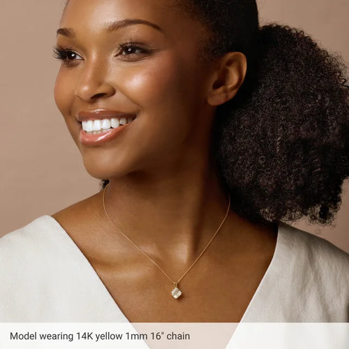 Load image 1 in gallery view. Model wearing the fine yellow gold chain with a square pendant; the caption in the photo reads 14K yellow 1mm 16 inch chain