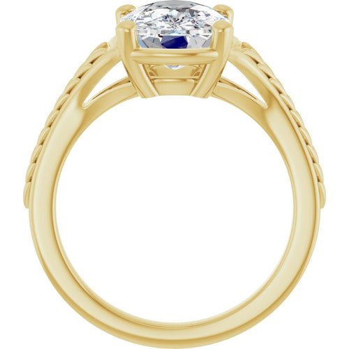 Load image 1 in gallery view. Front elevation of the 14K yellow gold solitaire, the elongated cushion diamond above an open gallery with hand-engraved leaf detail running along the shoulders