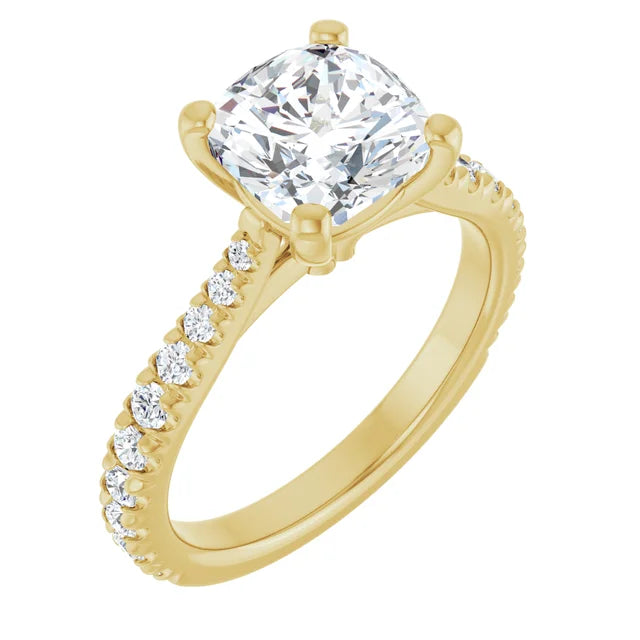 14K yellow gold engagement ring at a three-quarter angle, the 2 carat cushion-cut lab-grown diamond held in four prongs above a band set with French-set pave diamonds