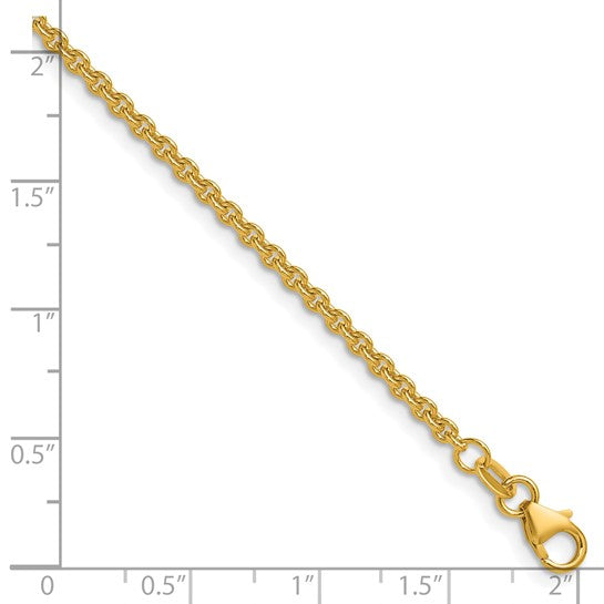 18K yellow gold cable chain against a ruler, showing the link size and lobster clasp