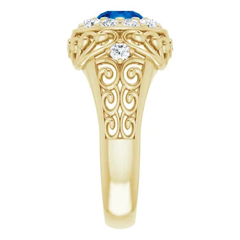 Load image 1 in gallery view. Gold  vintage ring with blue gemstone and diamond accents on a white background