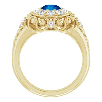 Gold  vintage ring with blue gemstone and diamond accents on a white background