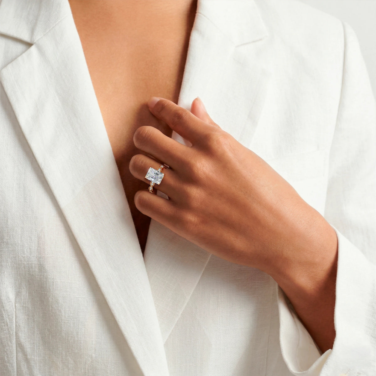 Custom 14K yellow gold radiant-cut lab-grown diamond engagement ring shown on the hand, render