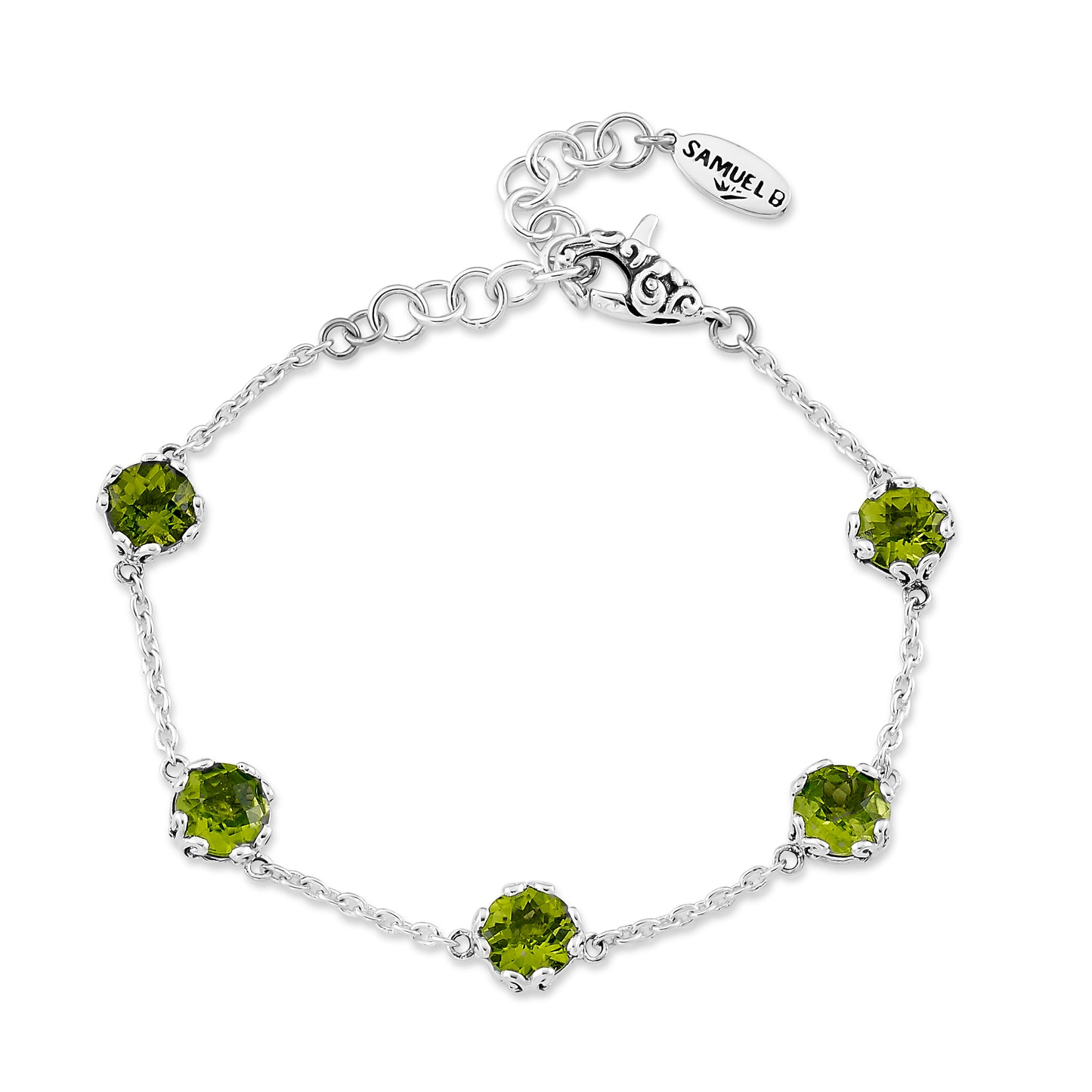 Silver bracelet with green gemstones on a white background