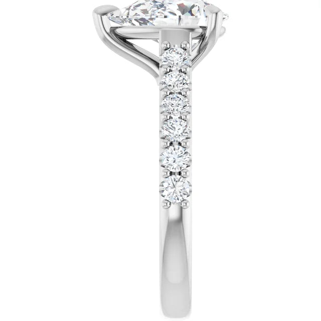 Side profile of the 14K white gold pear engagement ring, showing the row of round accent diamonds set along the shoulder and the band tapering toward the back