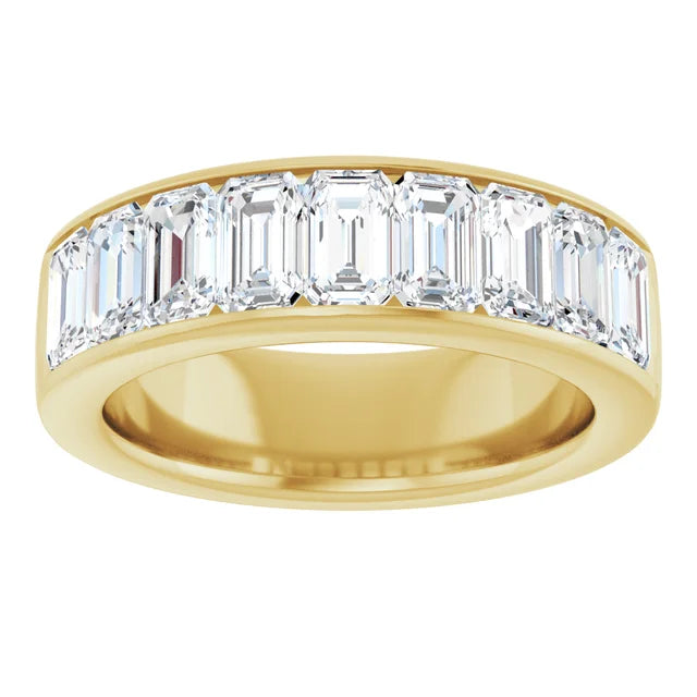 Channel-set emerald-cut lab-grown diamonds in a 14K yellow gold anniversary band, 2 3/4 carats total weight, shown in detail