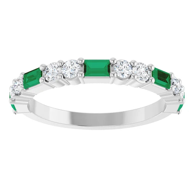Front view of the white gold band with emerald baguettes alternating with pairs of round lab-grown diamonds
