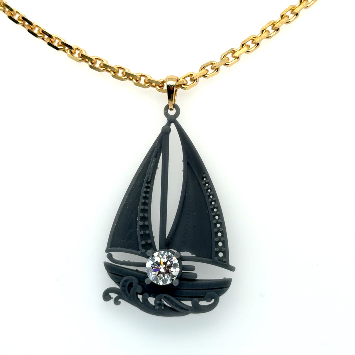 The 14K yellow gold chain, bail and center lab-grown diamond assembled with the sailboat's 3D-printed model, ahead of casting, Farsi Jewelers