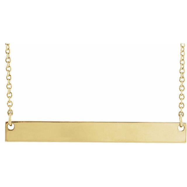 Polished 14K yellow gold engravable bar necklace shown blank, the bar set horizontally into a fine cable chain