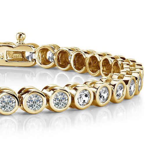Load image 1 in gallery view. 14K yellow gold bezel-set lab-grown diamond tennis bracelet, round diamonds each in a gold bezel, with a box clasp