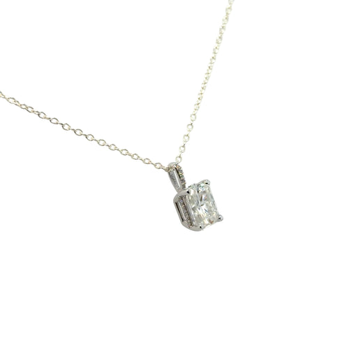 Load image 1 in gallery view. 14K white gold solitaire pendant mounting shown at an angle, holding a radiant-cut moissanite in four prongs, with small accent diamonds set along the bail. Shown on a display chain; chain and center stone are not included.