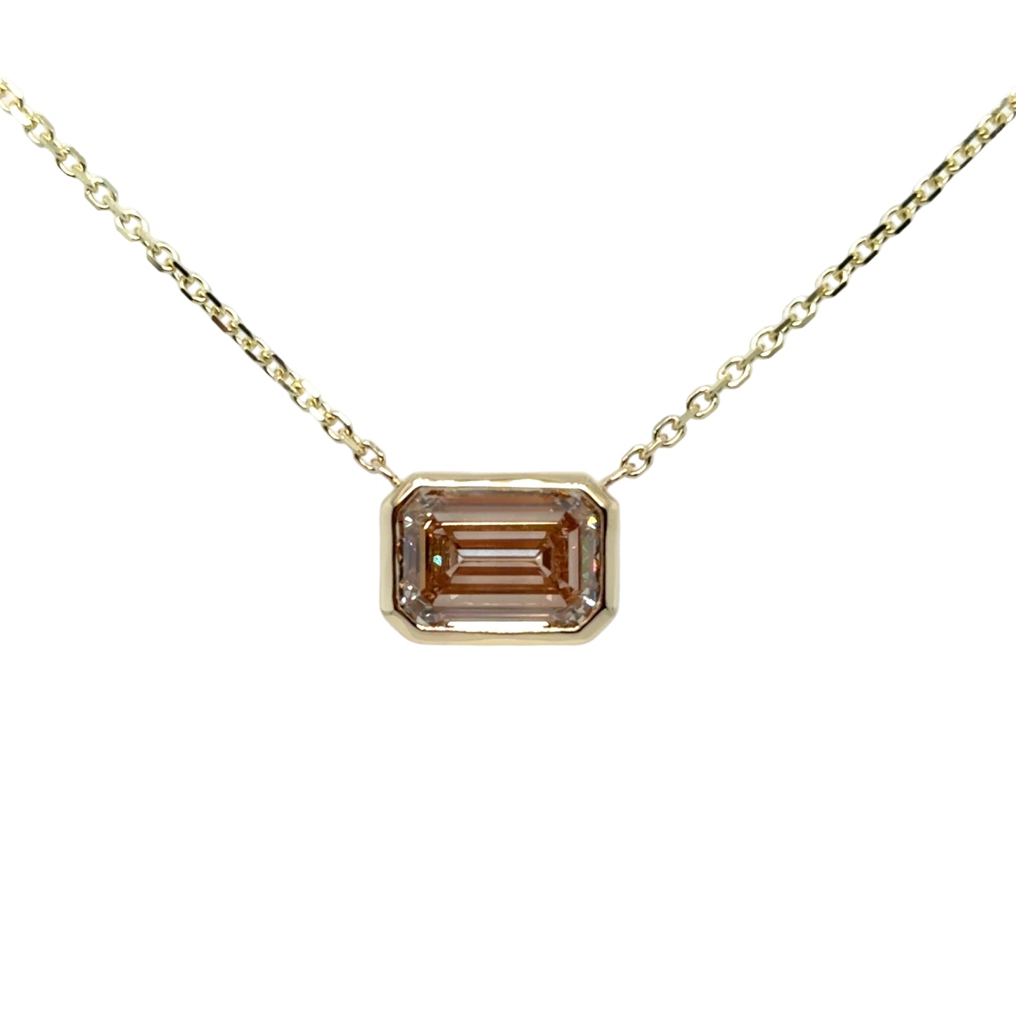 Emerald-cut fancy pinkish-brown lab-grown diamond bezel-set east-west in 14K yellow gold, suspended from a fine yellow gold cable chain