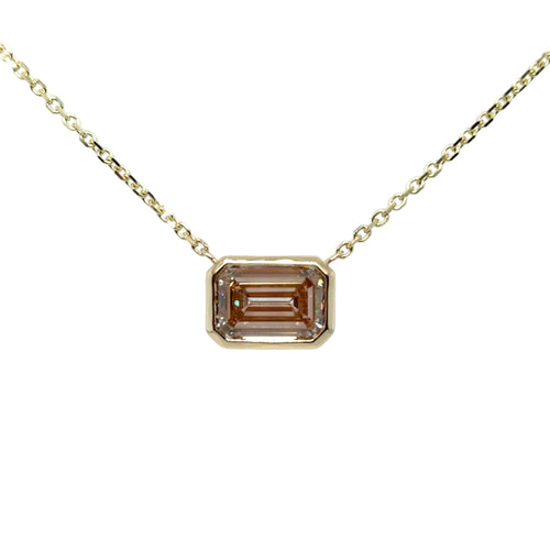 Load image 1 in gallery view. Emerald-cut fancy pinkish-brown lab-grown diamond bezel-set east-west in 14K yellow gold, suspended from a fine yellow gold cable chain
