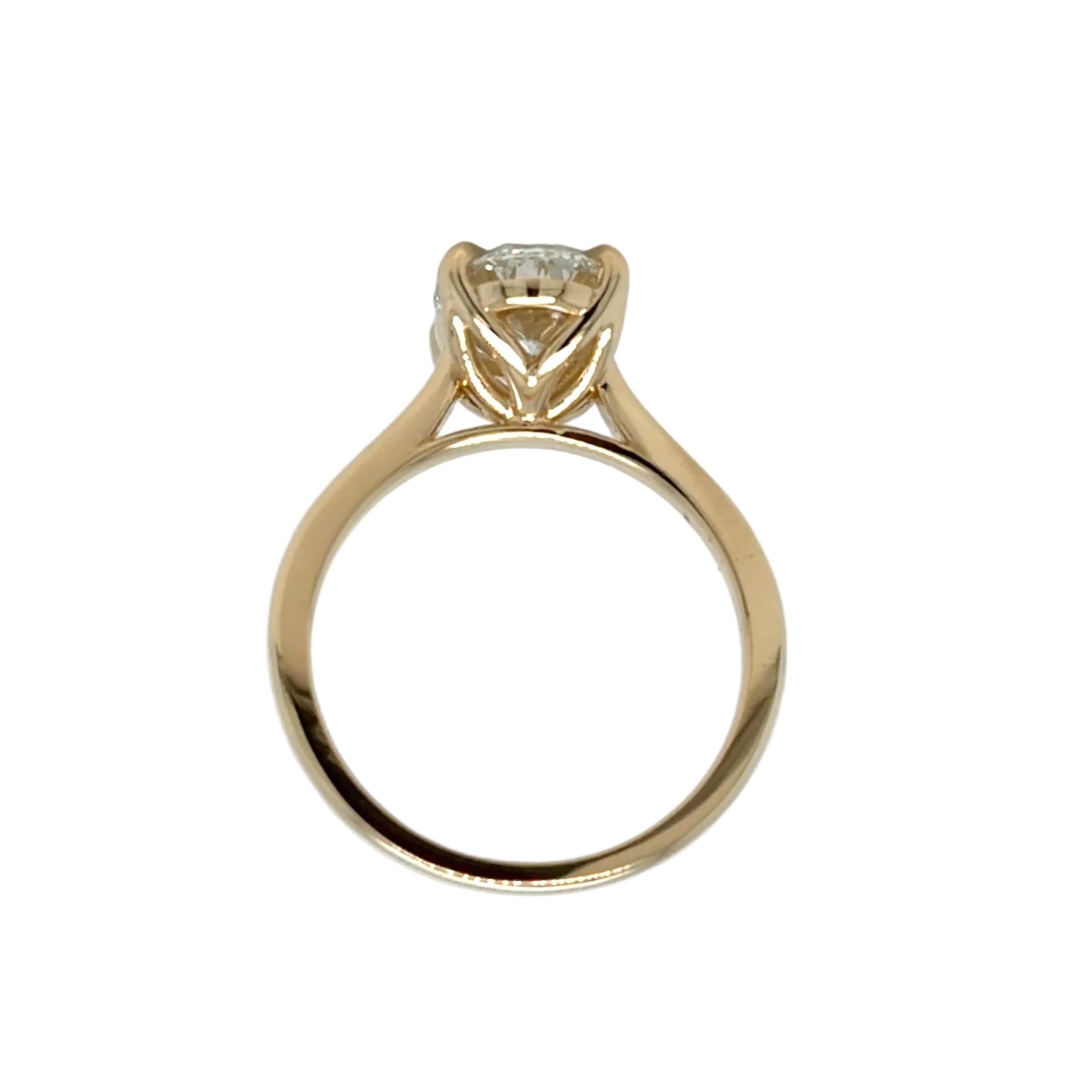 End-on view of the tulip head, its shaped petals cradling the 2.24 carat oval diamond above a plain polished cathedral shank