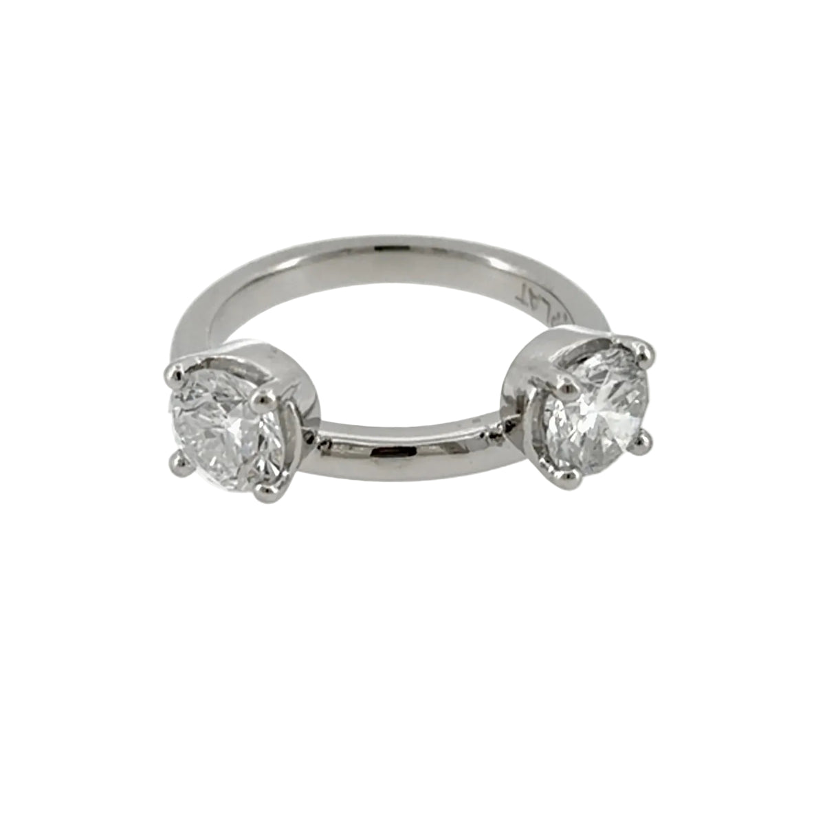 Platinum wrap-style ring enhancer with a round diamond in a four-prong setting on each side of a plain polished band, front view