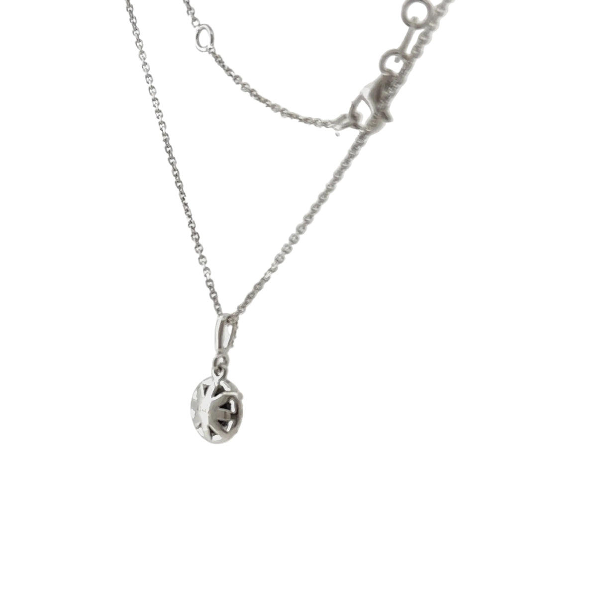 The pendant on its 14K white gold chain with the lobster clasp and the adjustable end of the chain