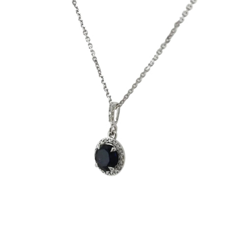 Load image 1 in gallery view. Side view of the blue sapphire halo pendant showing the diamond halo and the diamond-set bail on the white gold chain