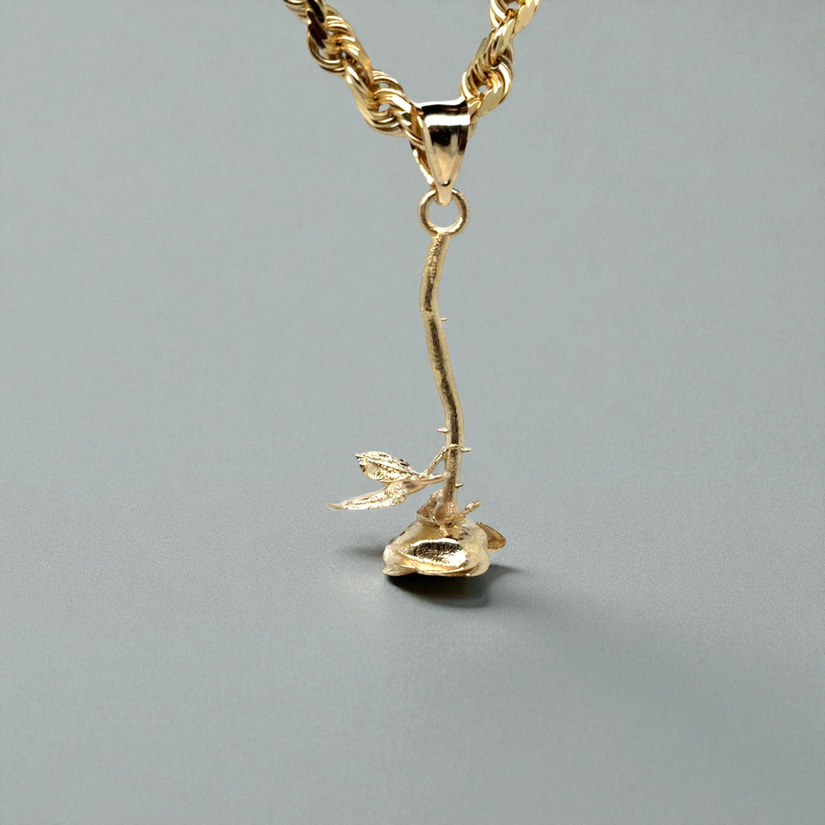 Custom designed 14K yellow upside-down rose 