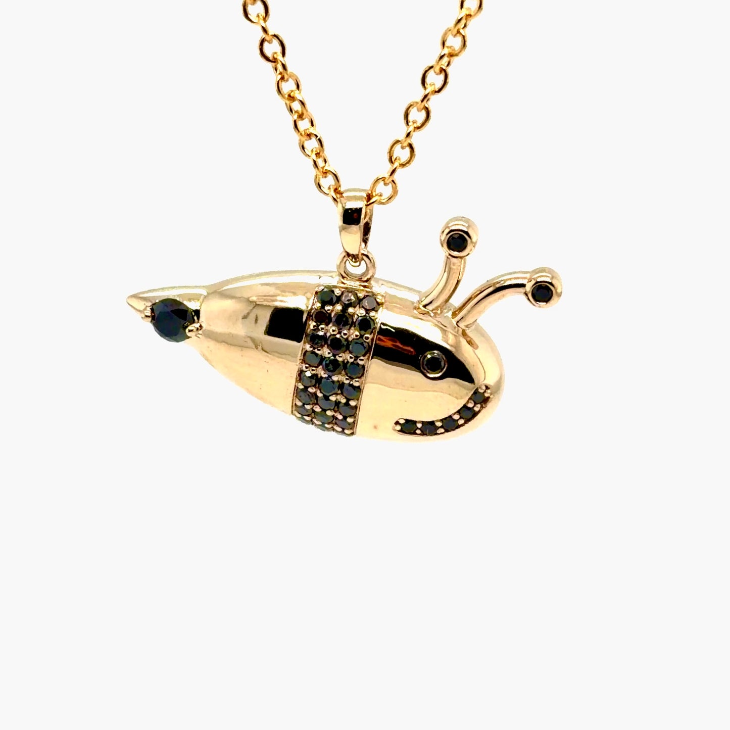 Finished 14K yellow gold bumblebee pendant with black diamond stripes, black diamond eyes and antenna tips, and a black diamond at the tail, on a gold cable chain