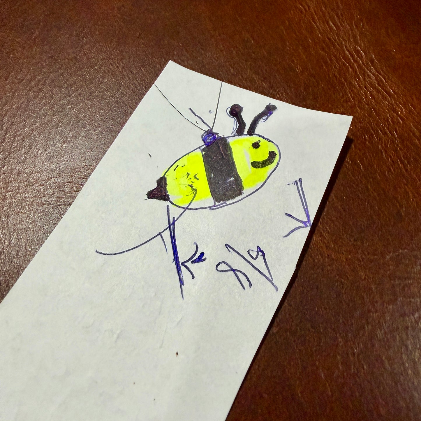 The original bumblebee drawing the pendant was made from — a childhood drawing in yellow and black marker on paper