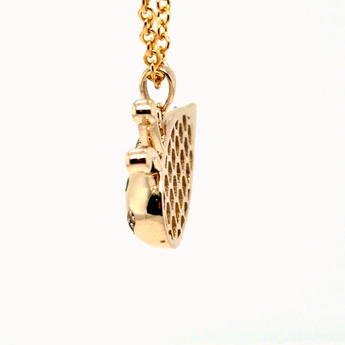Load image 1 in gallery view. Side profile of the 14K yellow gold bumblebee pendant showing the domed body and honeycomb back