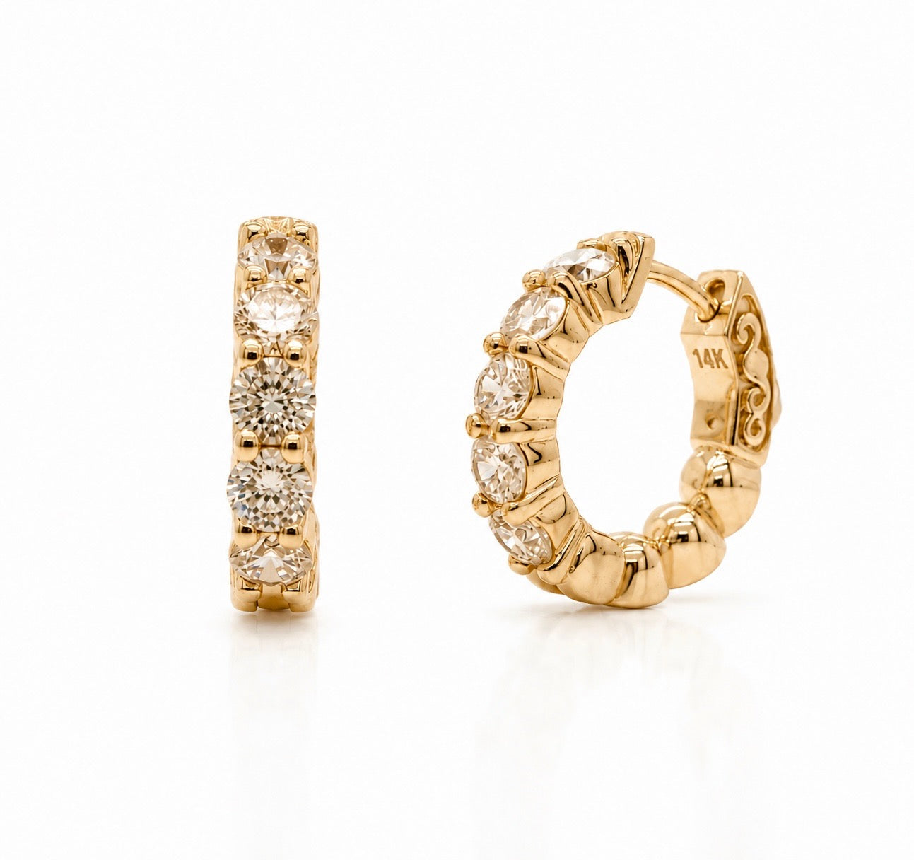 14K yellow gold huggie hoop earrings set with five round lab-grown diamonds each, shown face-on and in profile with the pierced scroll gallery visible