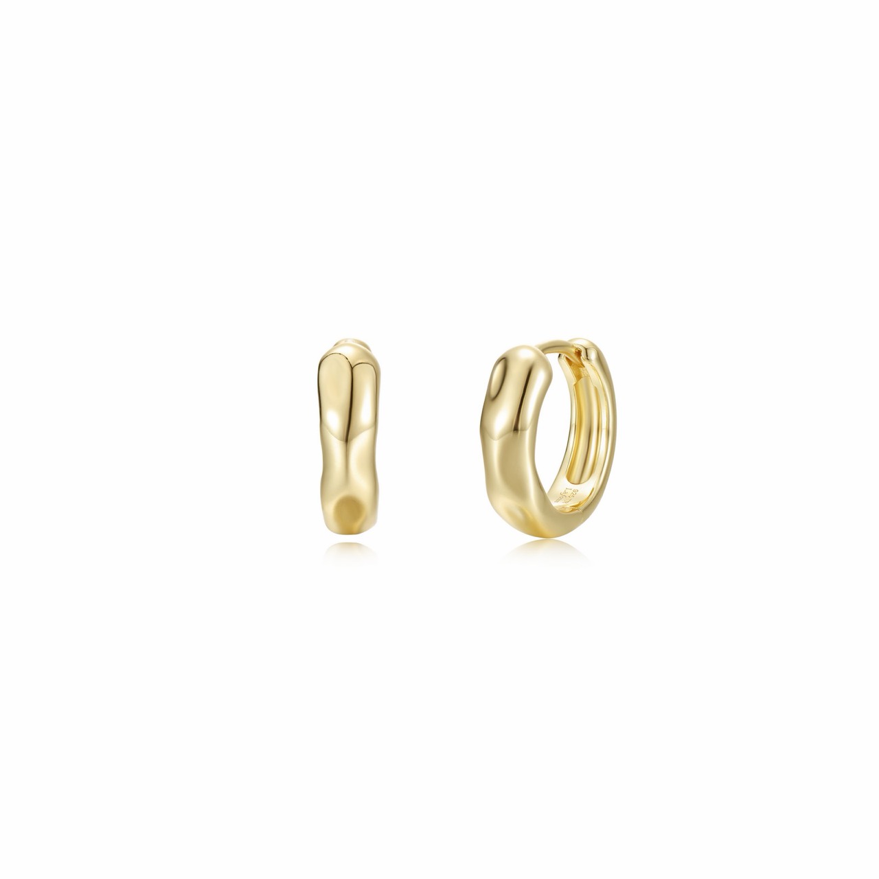 A pair of gold-finished huggie earrings with soft organic curves and a high-polished surface, shown open and closed on a hinged fitting