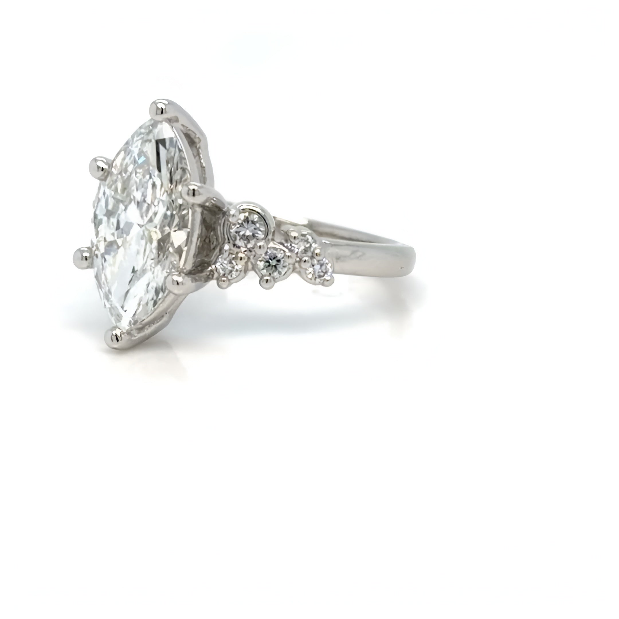 Engagement Rings Asymmetrical Marquise Cut Diamond Engagement Ring with Cluster Side Stones in Platinum