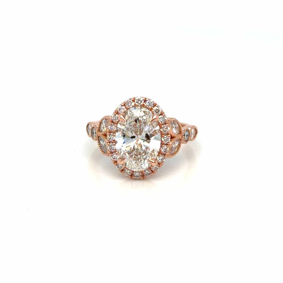 Finished 14K rose gold antique-inspired engagement ring, a 2.21 ct oval lab-grown diamond in a milgrain halo with bezel-set marquise and round diamonds on the shoulders, Farsi Jewelers