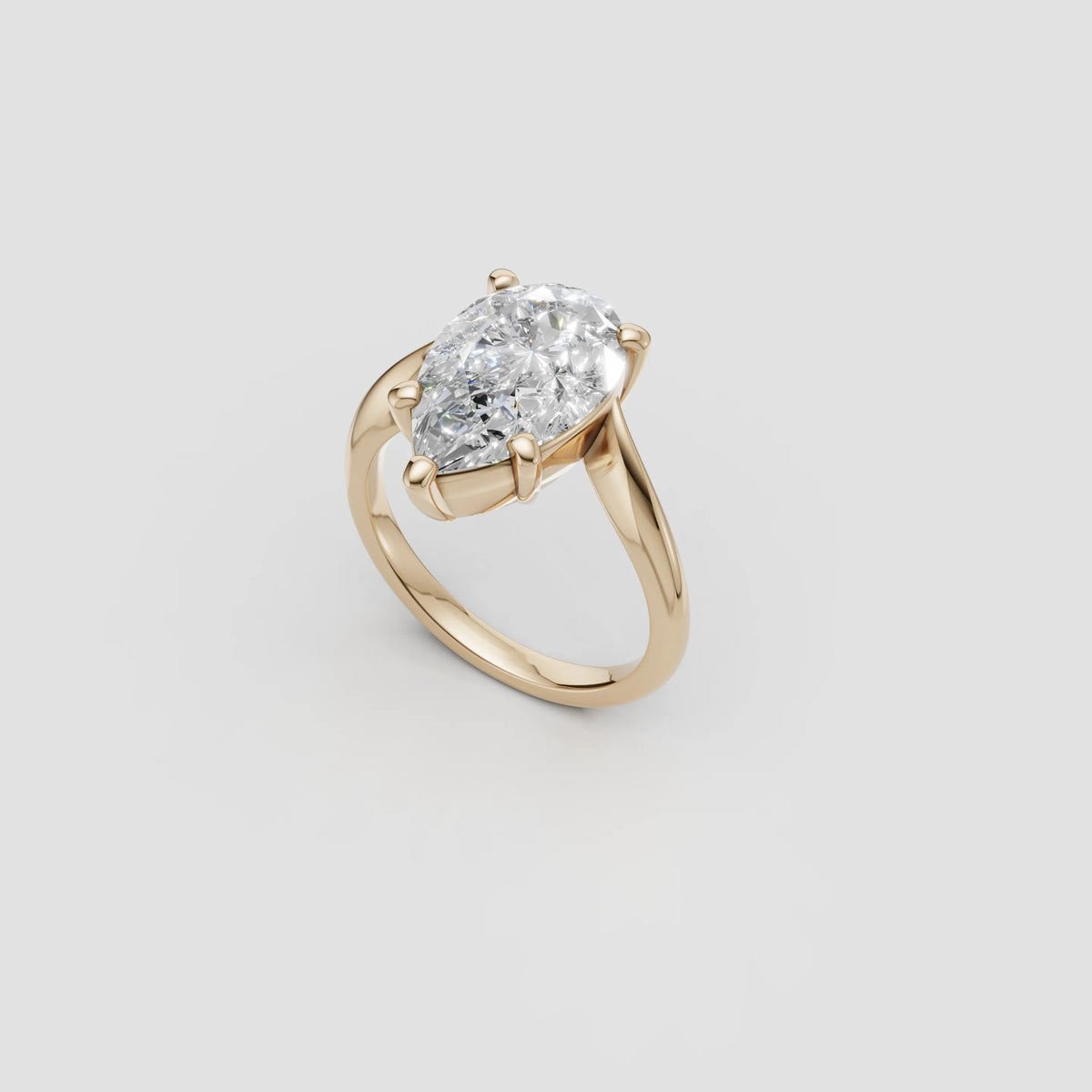 CAD design render of a custom engagement ring, a 4 carat pear-cut diamond set at an angle in an 18K yellow gold bypass shank, Farsi Jewelers