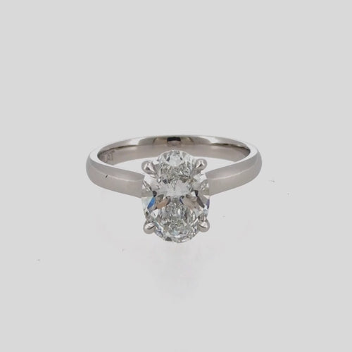 Load image 1 in gallery view. Video of a 2.44 carat oval lab-grown diamond cathedral engagement ring in platinum
