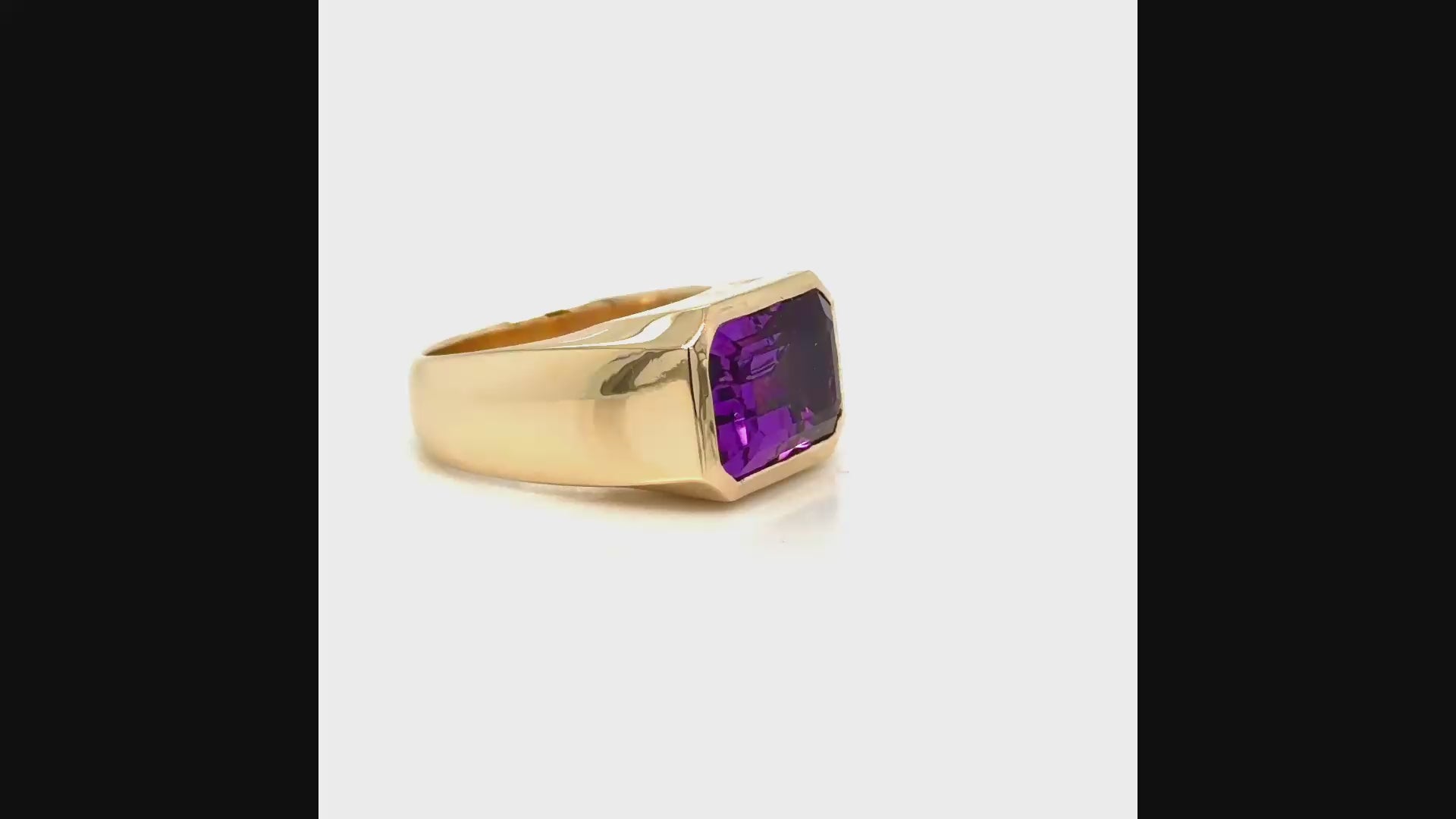 90-degree video of a custom 14K yellow gold east-to-west emerald-cut amethyst ring designed by Farsi Jewelers in Sandy Springs, Georgia.