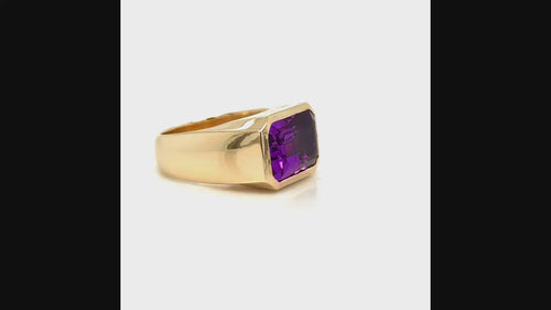 Load image 1 in gallery view. 90-degree video of a custom 14K yellow gold east-to-west emerald-cut amethyst ring designed by Farsi Jewelers in Sandy Springs, Georgia.