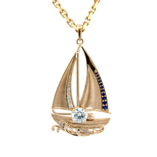 Load image 1 in gallery view. Video of the finished 14K yellow gold sailboat pendant turning in the light