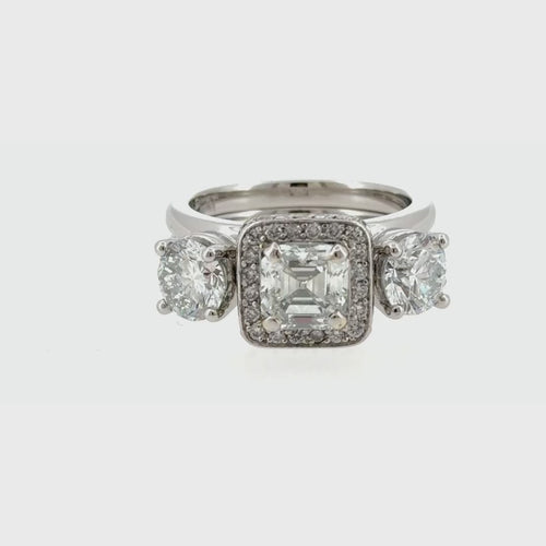 Load image 1 in gallery view. Video of the platinum wrap-style ring enhancer fitted around an engagement ring, turning to show every side