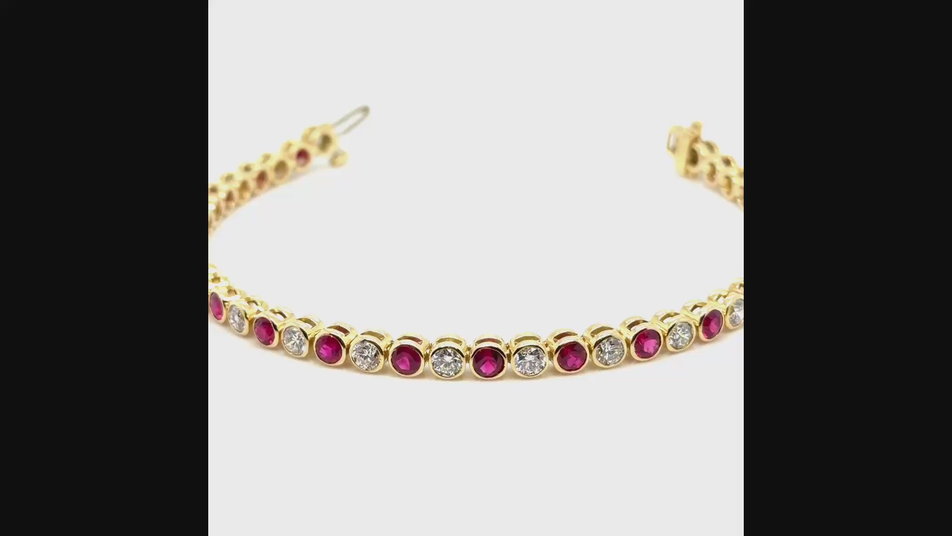 18K Yellow gold diamond and ruby bezel set tennis bracelet. farsi jewelers sandy springs 